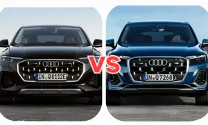 Dwa nowe Audi Q7 w zbliżeniu, czarne i granatowe, z napisem "VS" pośrodku.