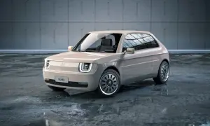 Nowoczesny polski fiat 126p w beżowym kolorze, z charakterystycznymi kwadratowymi światłami i stylowymi felgami, stoi na mokrej posadzce.
