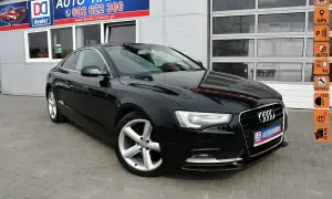 Eleganckie czarne Audi A5 z 2013 roku na placu komisu.